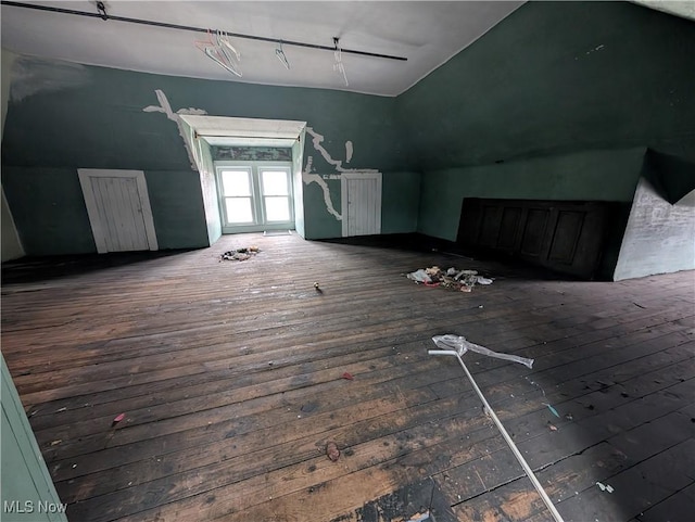 bonus room with dark wood-type flooring