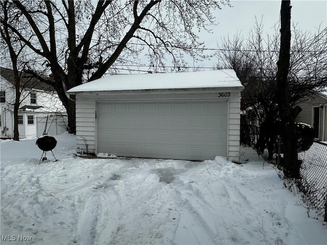 view of snow covered garage