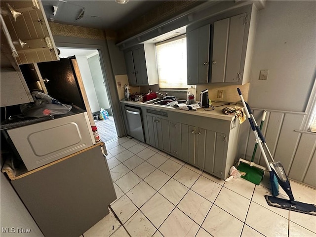 kitchen with dishwasher, gray cabinets, and light tile patterned flooring