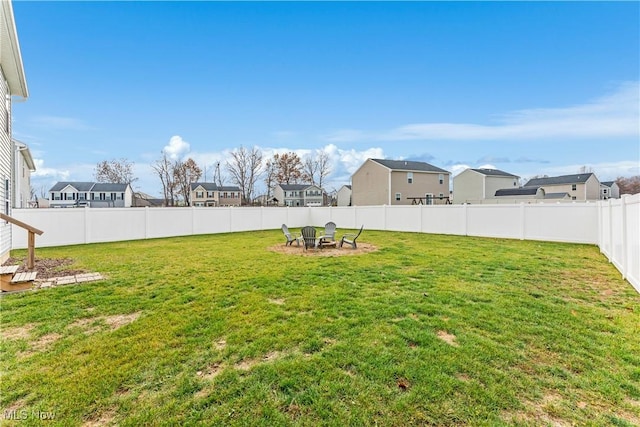 view of yard with an outdoor fire pit