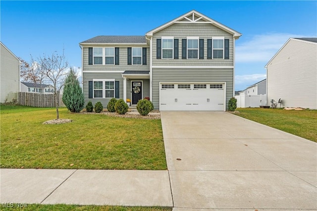 view of front of property with a garage and a front lawn