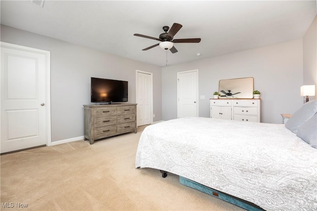 bedroom featuring ceiling fan and light colored carpet