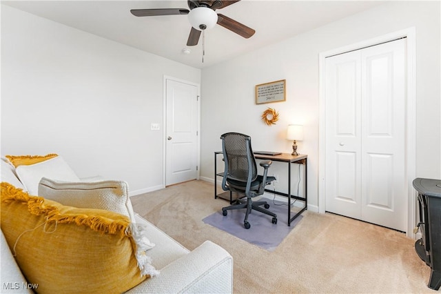 office featuring light colored carpet and ceiling fan