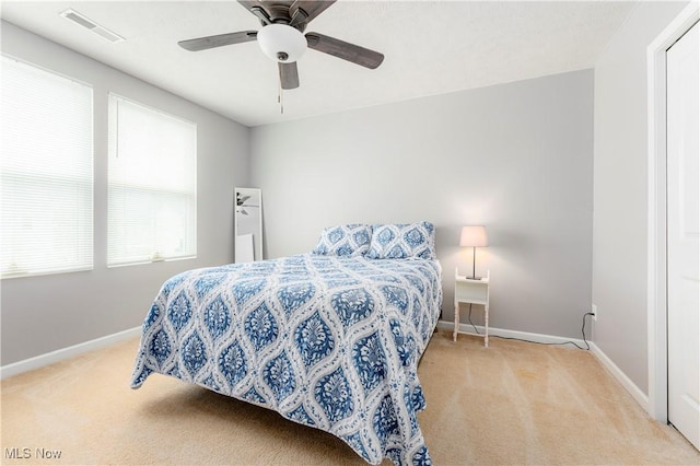 carpeted bedroom featuring ceiling fan