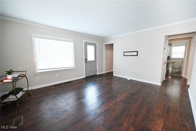 interior space with crown molding and dark hardwood / wood-style floors