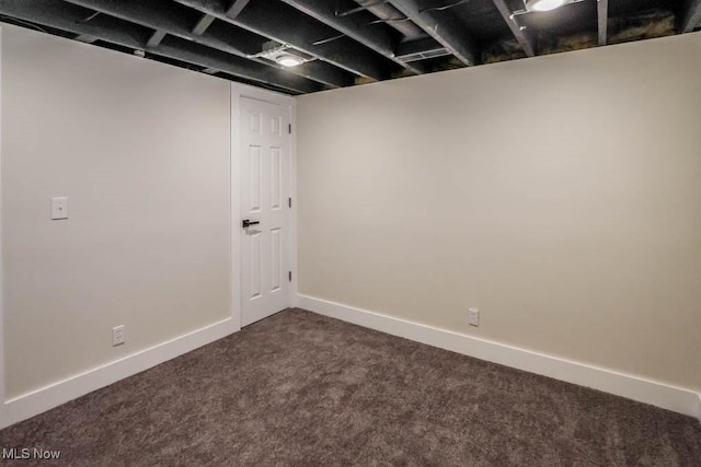 basement with dark carpet