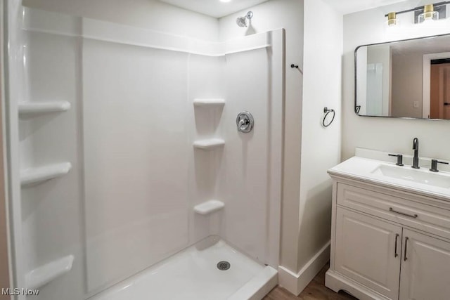 bathroom with vanity and walk in shower