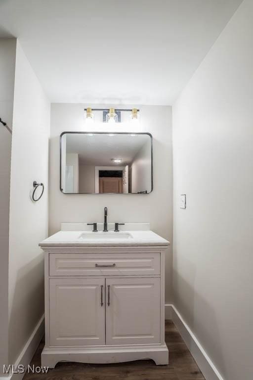 bathroom featuring hardwood / wood-style floors and vanity