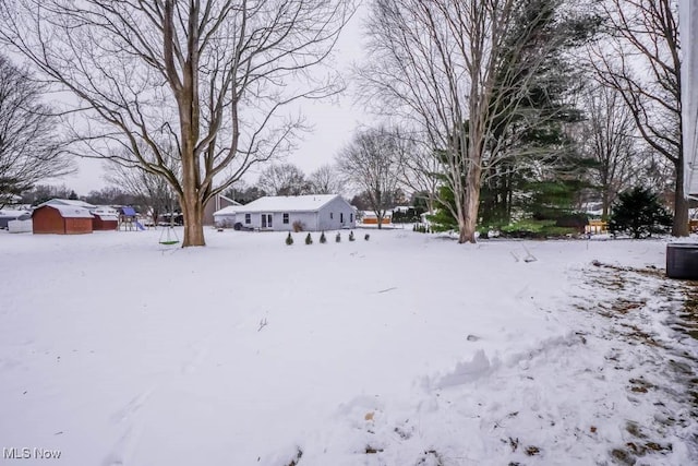 view of yard covered in snow