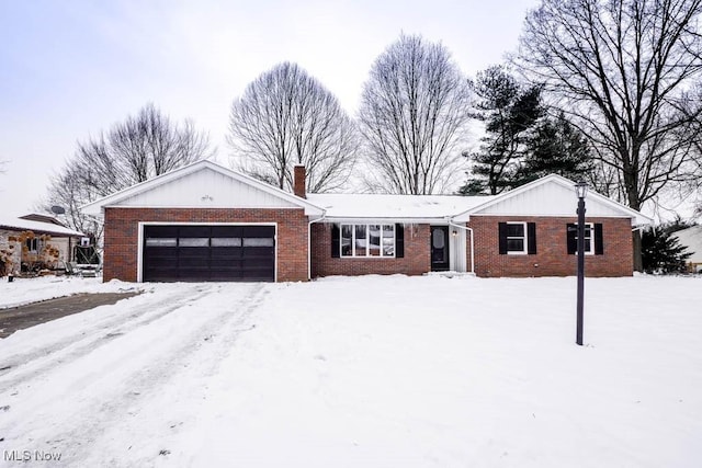 ranch-style home featuring a garage