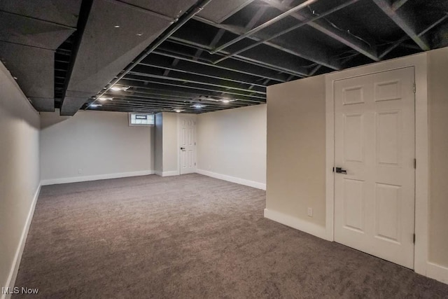 basement with dark colored carpet