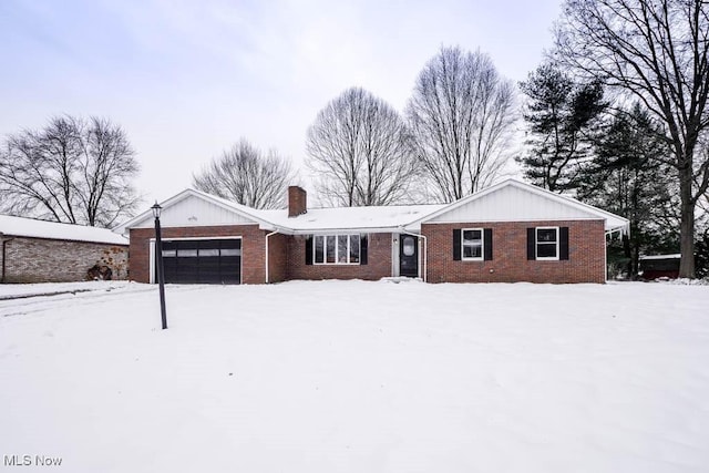 single story home featuring a garage