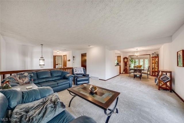 carpeted living room with a textured ceiling