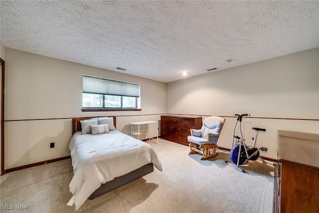 carpeted bedroom with a textured ceiling