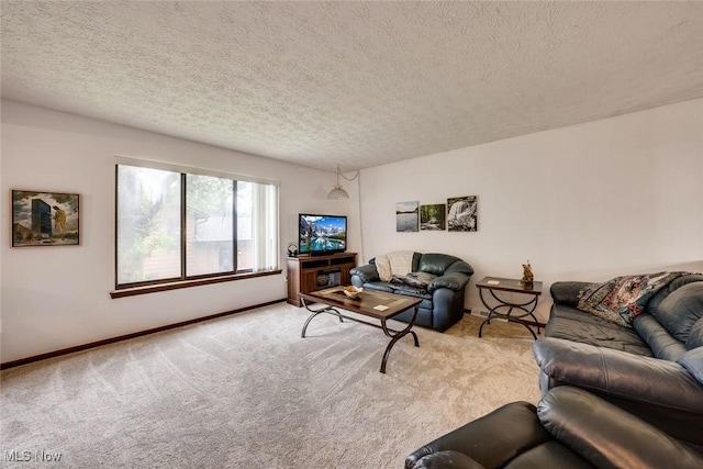 carpeted living room featuring a textured ceiling