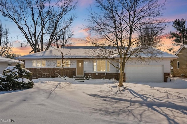 ranch-style house featuring a garage