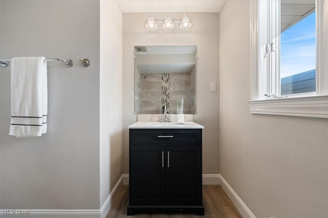 bathroom with hardwood / wood-style floors and vanity