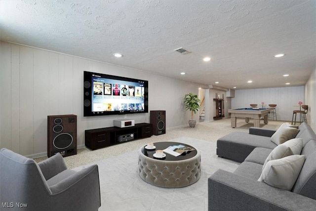 living room featuring a textured ceiling and billiards