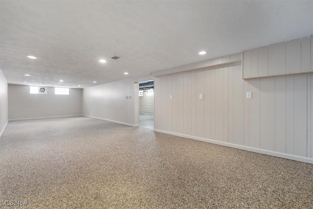 basement with wooden walls