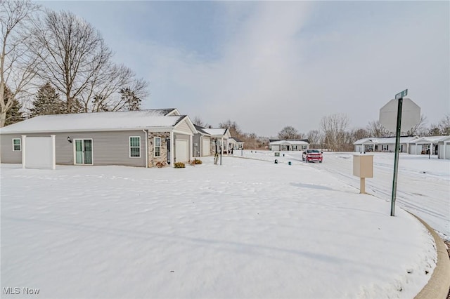 view of yard layered in snow