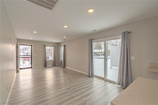 unfurnished living room with light wood-type flooring