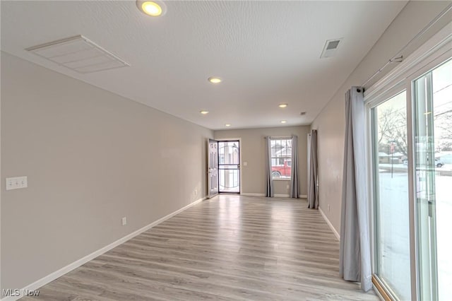 unfurnished room featuring light wood-type flooring