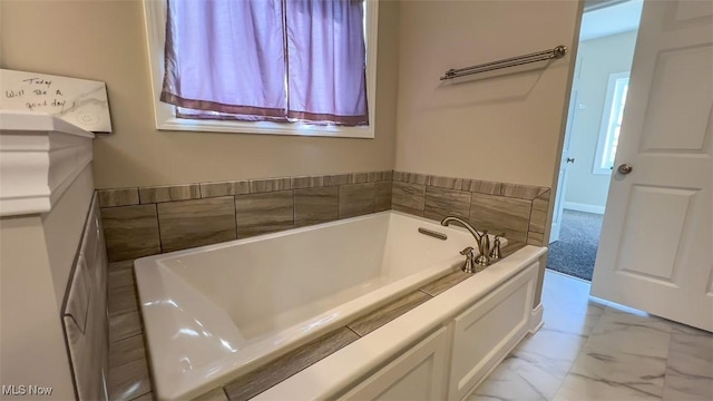 bathroom with a tub to relax in