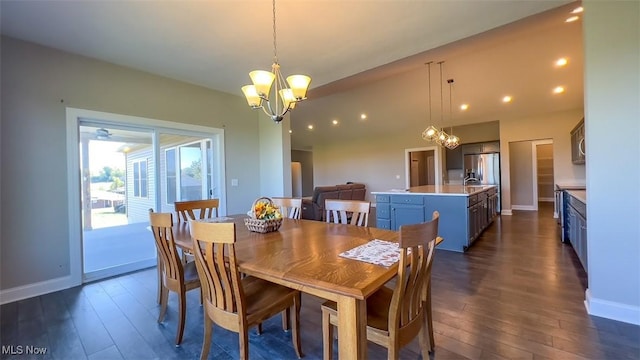 dining area featuring a notable chandelier and dark hardwood / wood-style floors