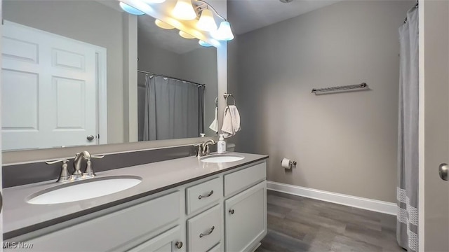 bathroom featuring hardwood / wood-style flooring and vanity