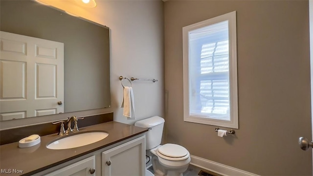 bathroom with vanity and toilet