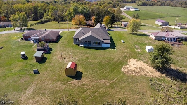 birds eye view of property with a rural view