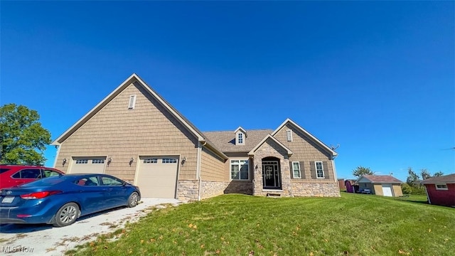 view of front of property featuring a garage and a front lawn