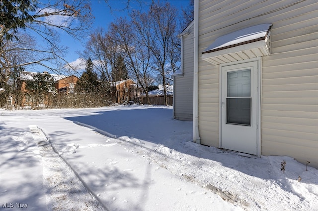 view of yard covered in snow