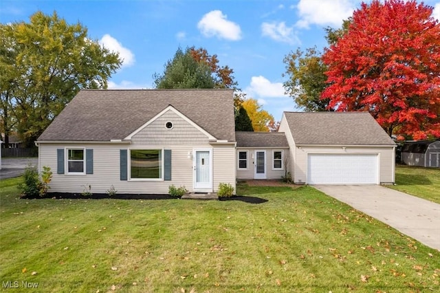 view of front of house featuring a garage and a front yard