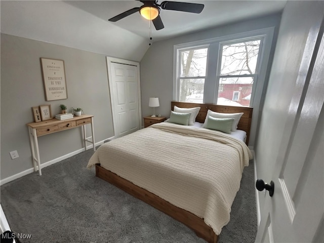 carpeted bedroom with ceiling fan, a closet, and lofted ceiling