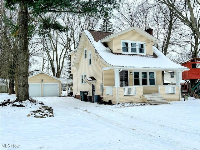 view of front of home with an outbuilding and a garage