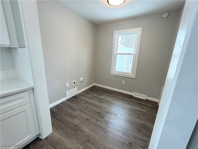 unfurnished room with dark hardwood / wood-style floors