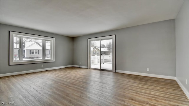 unfurnished room featuring light wood-type flooring