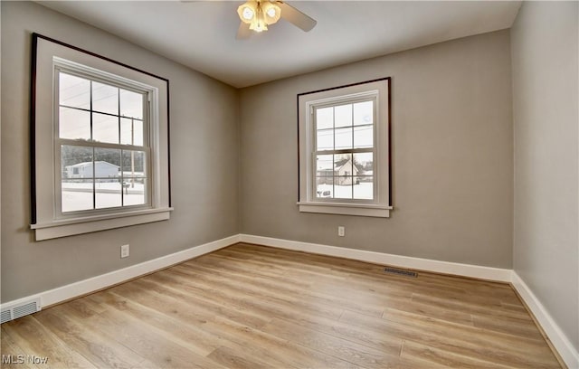 unfurnished room with ceiling fan and light hardwood / wood-style floors