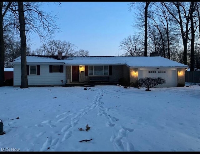 single story home featuring a garage