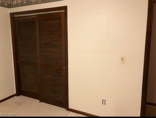 unfurnished bedroom with light colored carpet