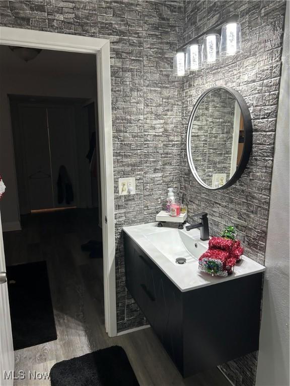 bathroom featuring wood-type flooring and vanity