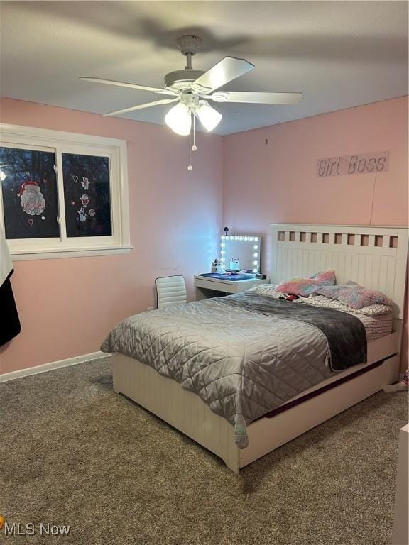 carpeted bedroom featuring ceiling fan