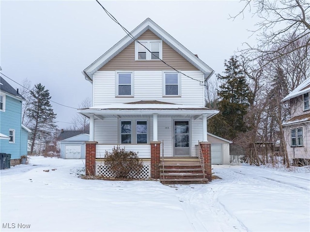 front of property featuring a garage and an outdoor structure