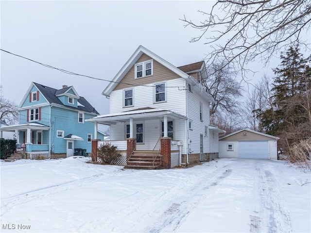 view of front of house with an outbuilding, a porch, and a garage