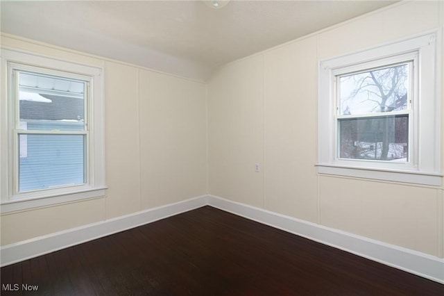 unfurnished room featuring wood-type flooring