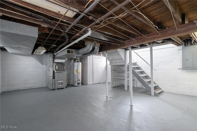 basement featuring gas water heater, heating unit, and electric panel