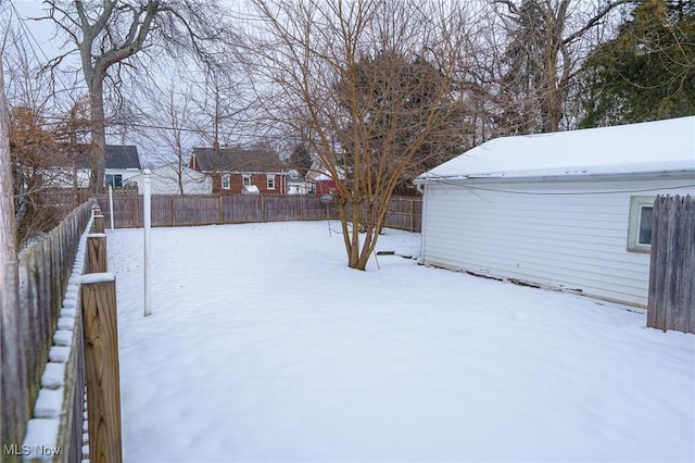 view of yard layered in snow