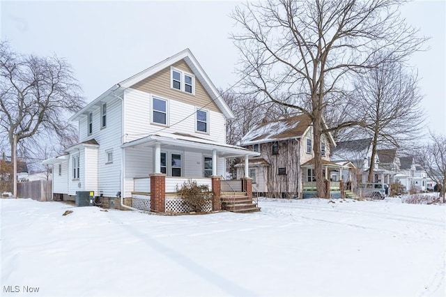 view of front of home featuring central AC unit and a porch