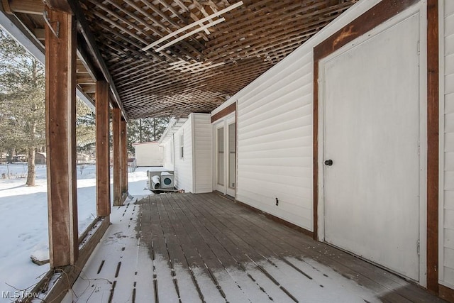 view of snow covered deck